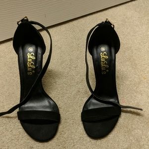 Black spiked heel with ankle strap